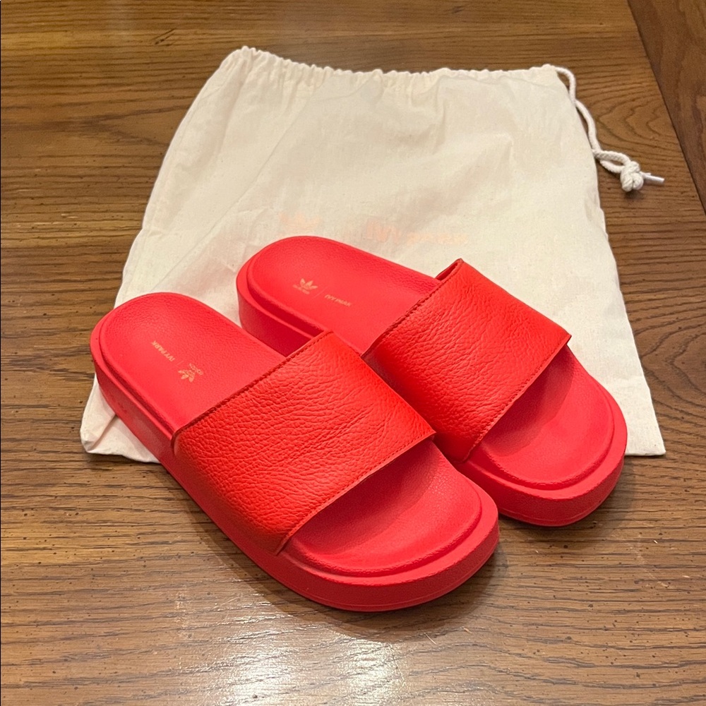 Adidas Bold Red Slide Sandals with Wide Strap. 
These run big!